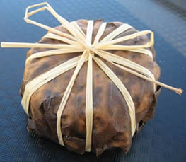 Bobbin is soft creamy unpasteurised goats milk cheese. It is wrapped in white wine soaked sweet chestnut leaves & tied with raffia