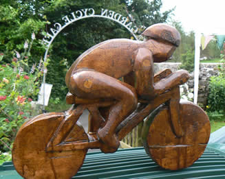 Wooden Cyclist in Hardwood at Greystoke Cycle Cafe with Alister Neville -carved by the tutor!